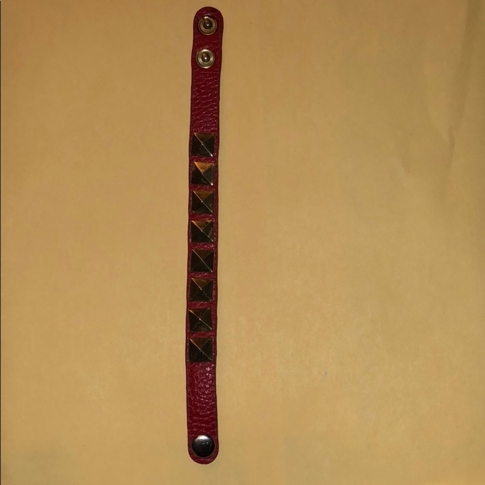 Red bracelet with gold studs